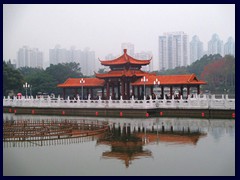 Lizhi Park (Lychee Park) with Lihu Lake.This park is situated right next to Shennan Road, Shun Hing Square and KK100. Here you find traditional Chinese architecture, like this pavilion, and views of Shenzhen's tallest buildings.